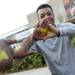 Michigan fan Tyler Corneous, 18, of Atlanta, flashes a block M that he had painted on his plams outside of the Georgia Dome before the start of the national championship game in Atlanta on Monday, April 8, 2013. Melanie Maxwell I AnnArbor.com